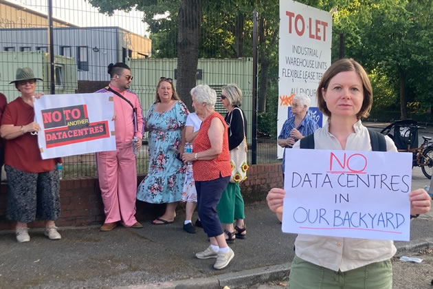 Residents ogathered outside the Frogmore Industrial Estate on Acton Lane to protest