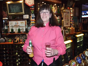 Reverend Derath Durkin behind the bar