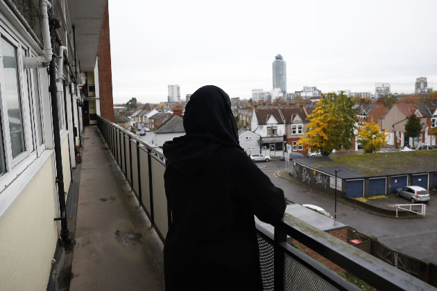 Iman Abdikarim looks out from a balcony at Charlton House