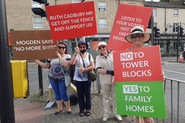 Some of the placards used in the protest outside the Holiday Inn Brentford 