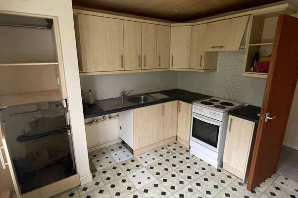 A kitchen with a tile floor 