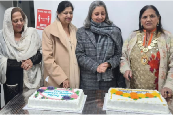 Cutting the cake at the celebratory event 