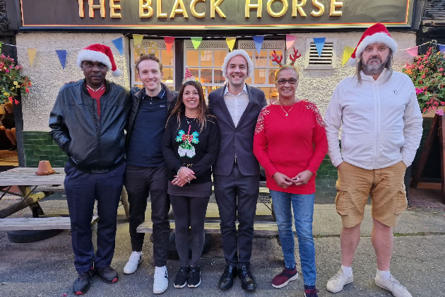 James Murray (second from right) with Black Horse customers before the closure 