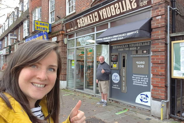 Megan and Tony socially distance outside the dry cleaners