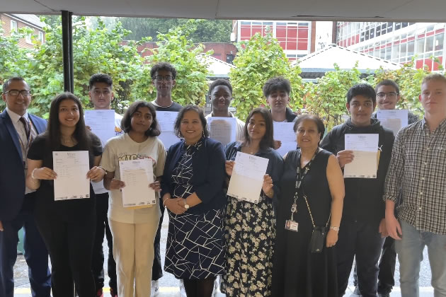 Students who attained Grades 8-9 with Ms Aruna Sharma (middle), Head of Upper School, Dr Parimal Bhatt (left), Senior Assistant Headteacher, Ms Gopali Nagi (right), and Head of Year, Mr Rhys Jones (right)