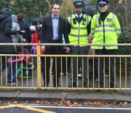 Bassam Mahfouz and police officers at a pedestrian crossing