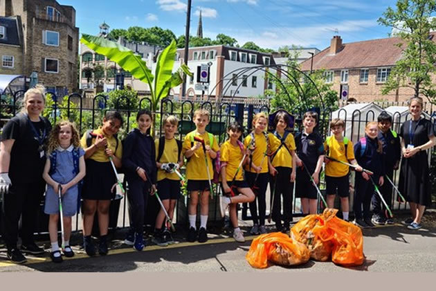 Alison Lakey (left) takes part in a litter pick with children from Belmont Primary and staff member Jenny Nicholas