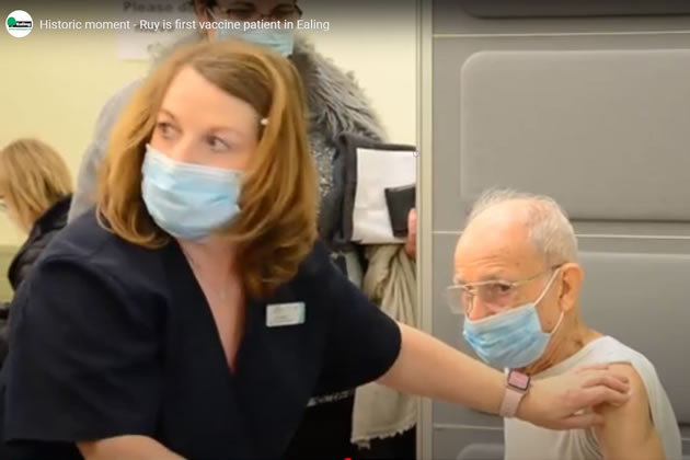 Ruy Silva receives his vaccine from Julie Belton 