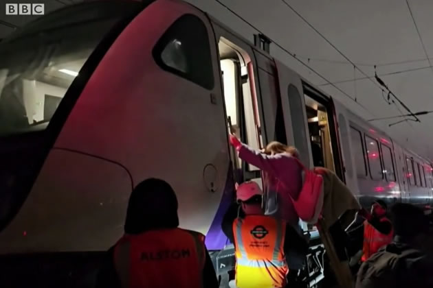 Passengers being escorted off the stricken train when overhead cables failed last year 