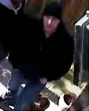 Suspect 2 is described as a white man wearing a black beanie style hat, black jacket and jeans